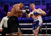 two boxers fighting in a boxing ring