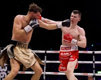 two boxers in action in a boxing ring